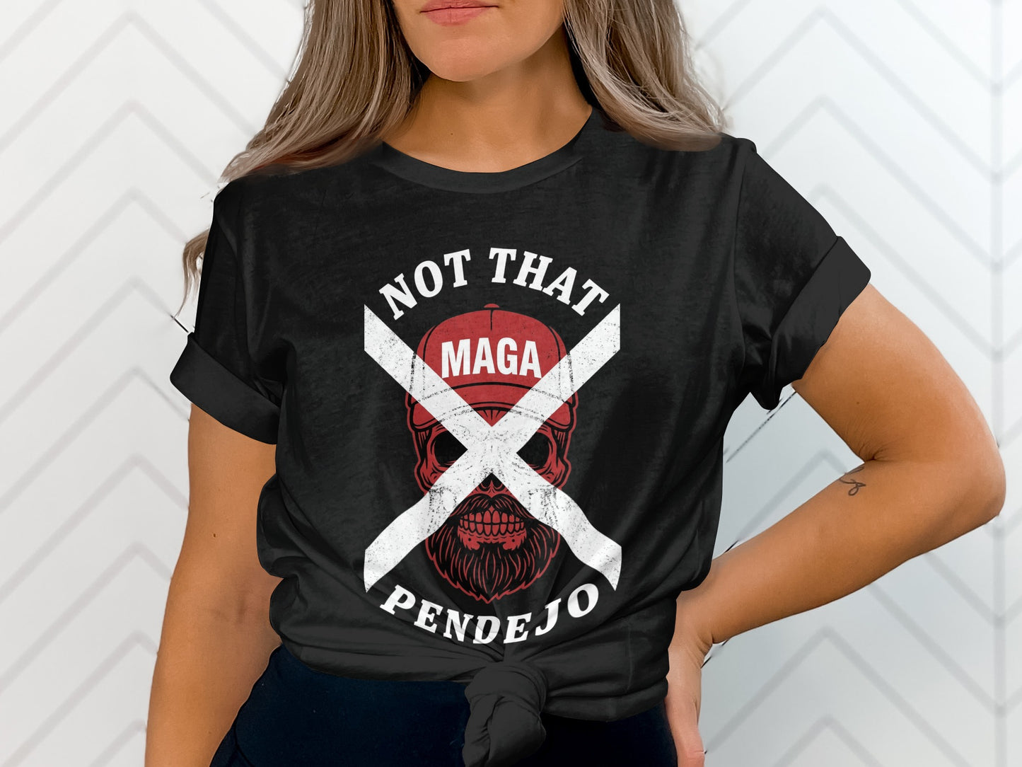Black t-shirt with white text reading "NOT THAT MAGA PENDEJO" and a skull graphic.