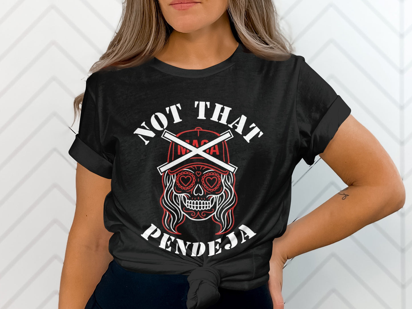 Black t-shirt with "NOT THAT PENDEJA" and a skull graphic.