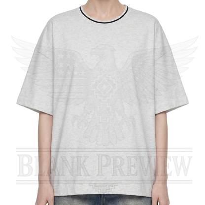 A person wearing a gray t-shirt with an eagle design printed on it.