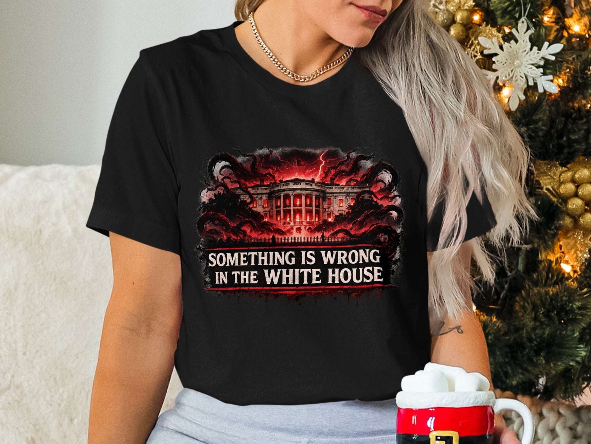 Black t-shirt with "Something is wrong in the White House" text and ominous White House illustration.