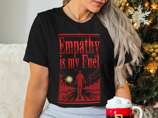 Black t-shirt with "Empathy is my Fuel" and a glowing red figure on a path.