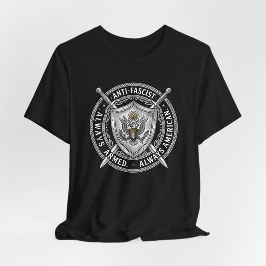 Black t-shirt with "Always Armed, Always American, Anti-Fascist" emblem.