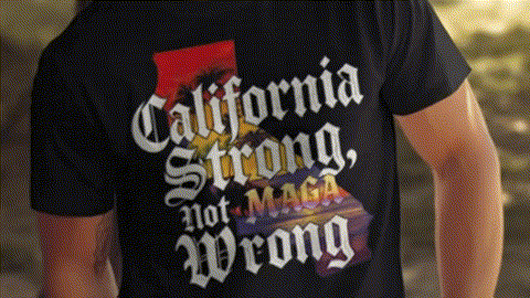 a person wearing a black t-shirt with the text "California Strong, Not MEGA" printed on it.