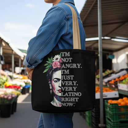 Black tote bag with Frida Kahlo portrait and quote "I'm not angry. I'm just very, very latino right now."