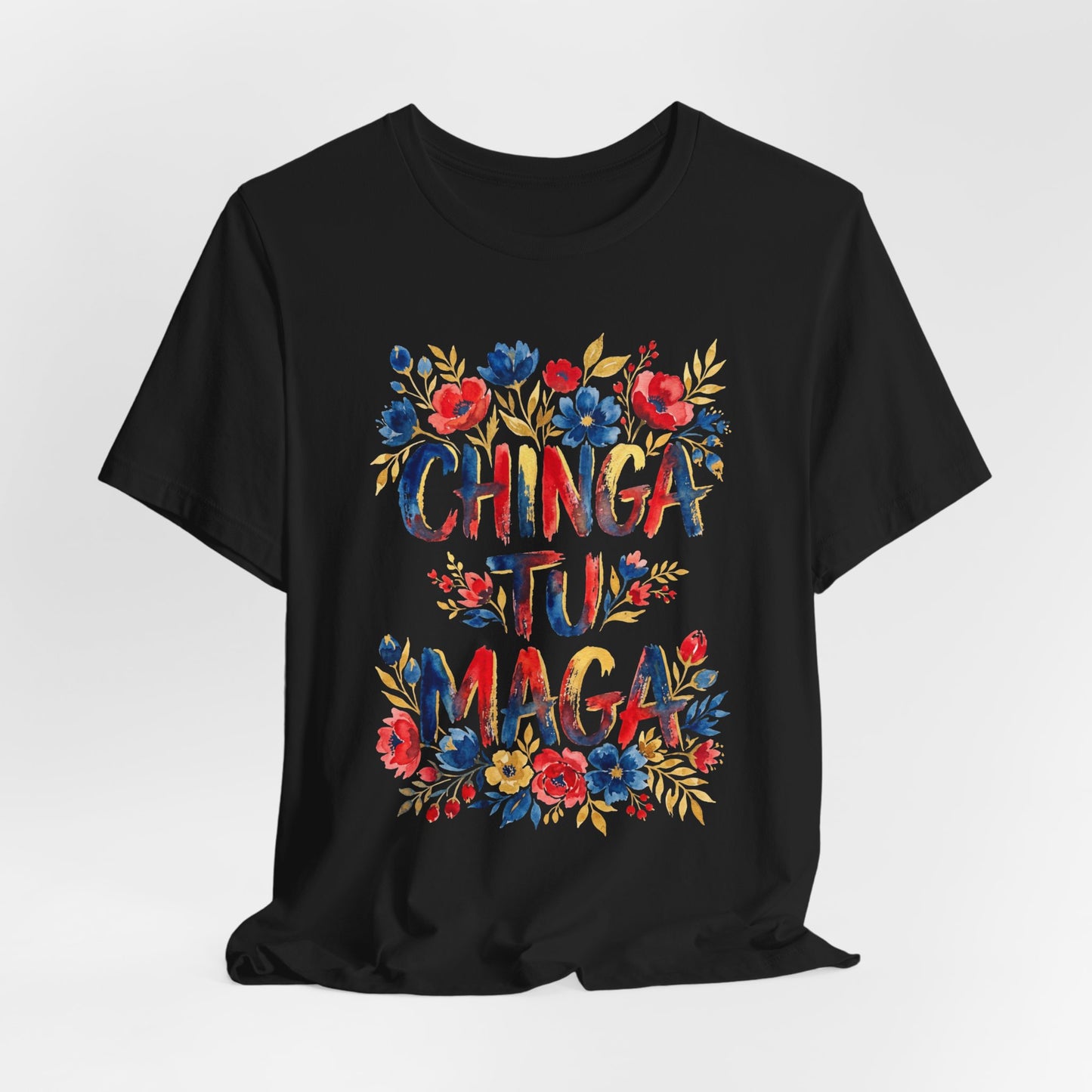 Black t-shirt with colorful "CHINGA TU MAGA" text and floral design.