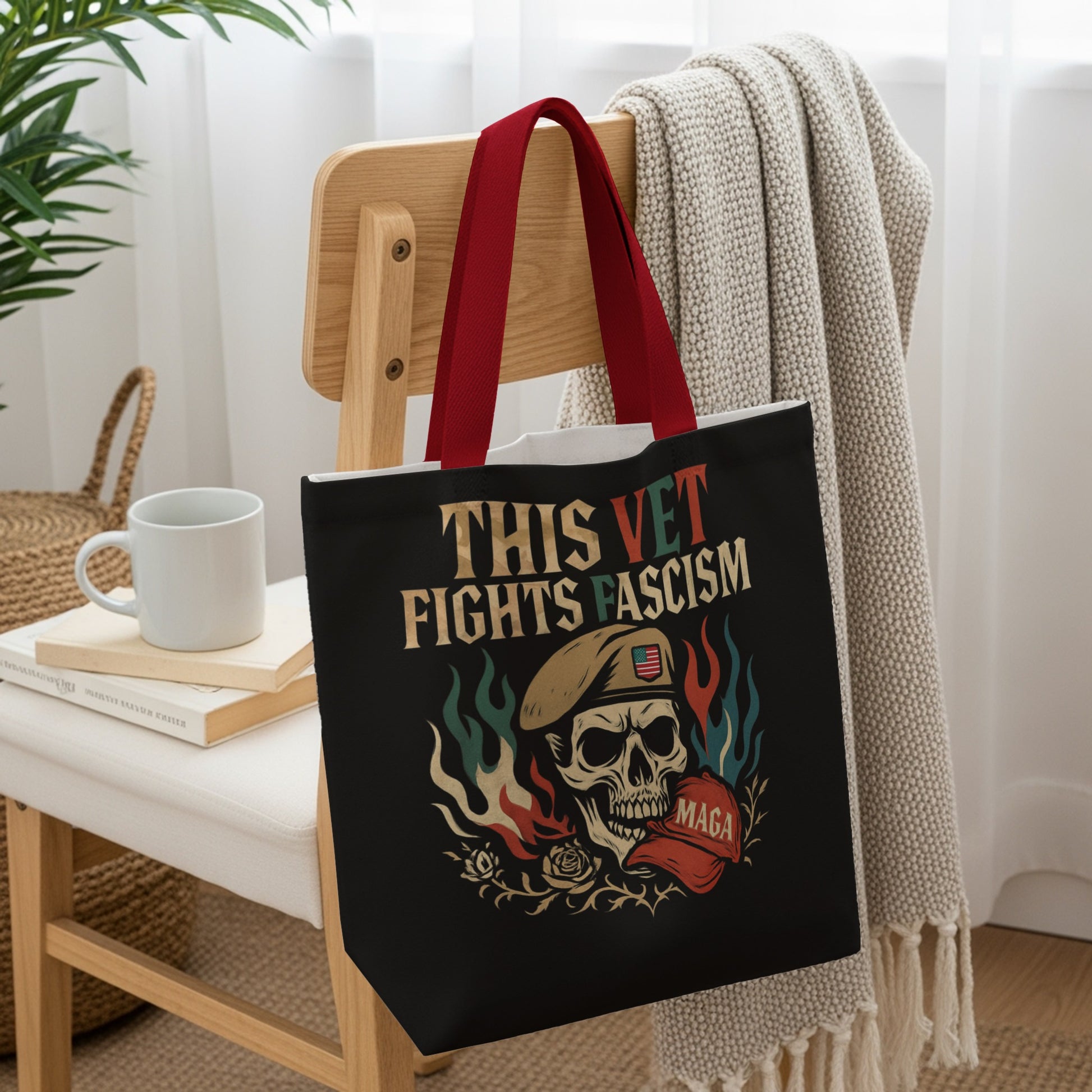 Black tote bag with skull, flag, and "THIS VET FIGHTS FASCISM" text.