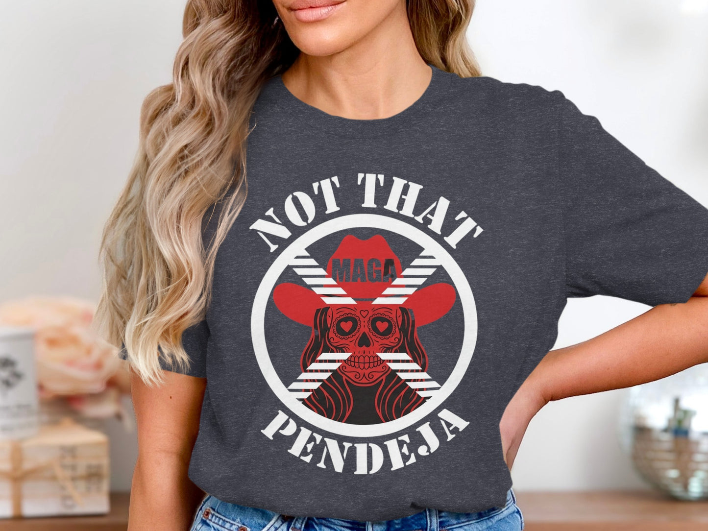 Dark t-shirt with graphic of skull wearing cowboy hat and text "NOT THAT PENDEJA".