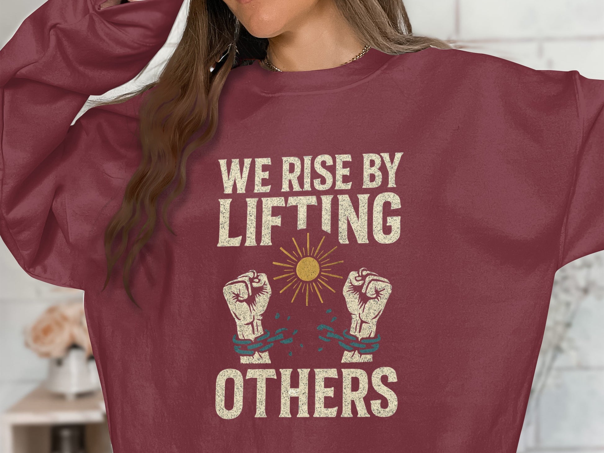 We Rise By Lifting Others Graphic Sweatshirt product