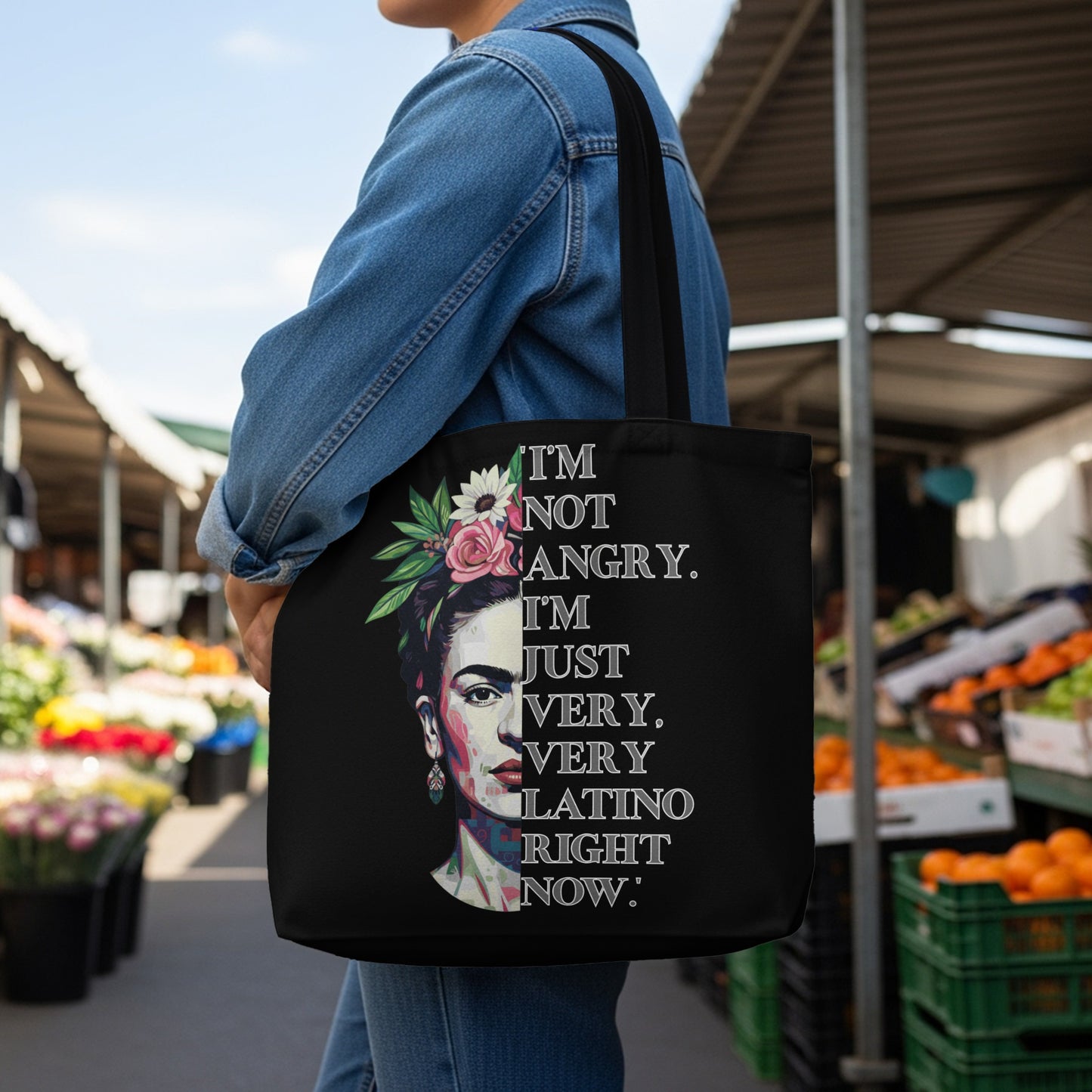 Black tote bag with Frida Kahlo portrait and quote "I'm not angry. I'm just very, very latino right now."