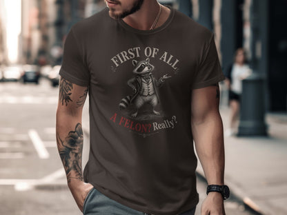 T-shirt with raccoon wearing a suit, "First of all, a felon? Really?"