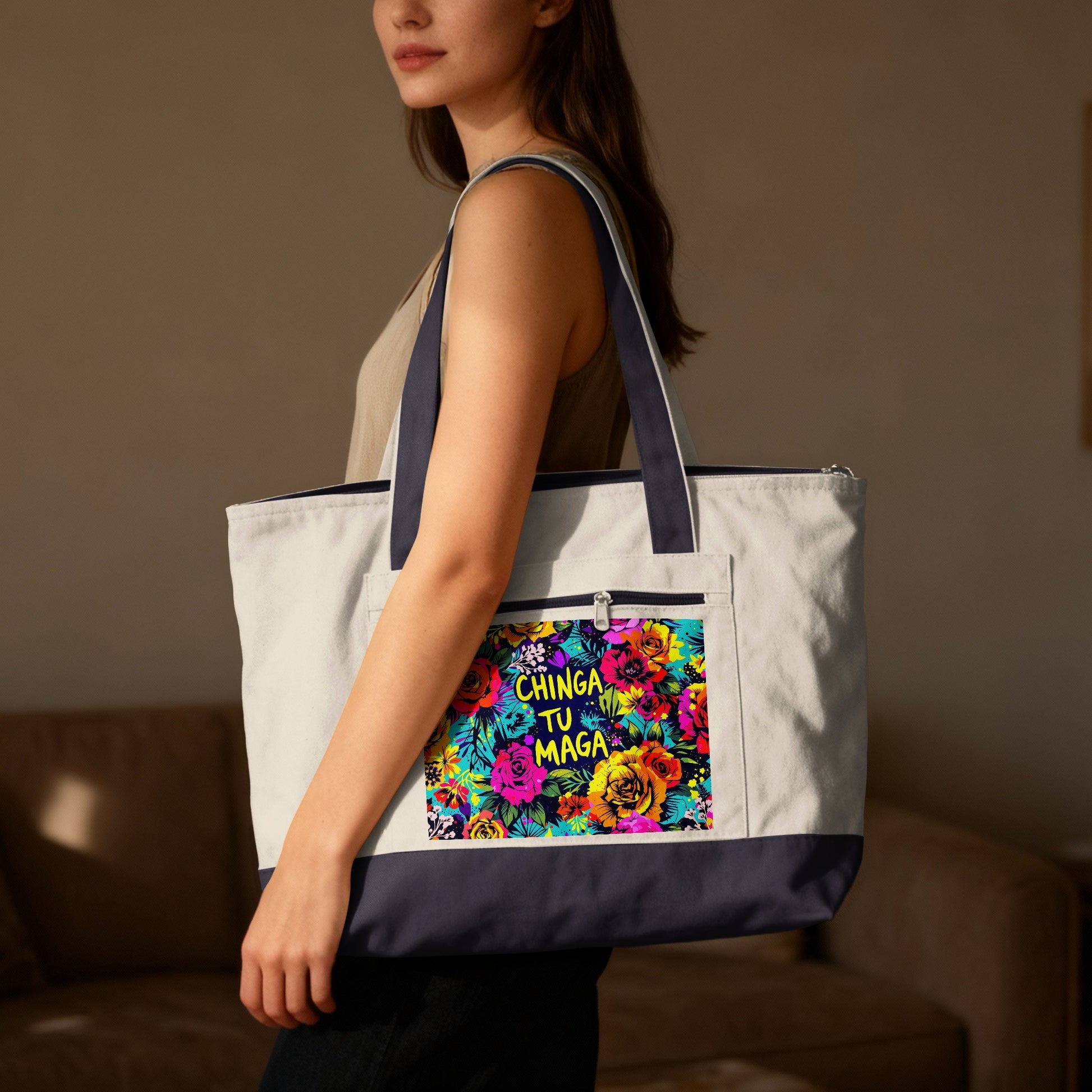 Woman holding white canvas tote bag with colorful floral pattern and text.