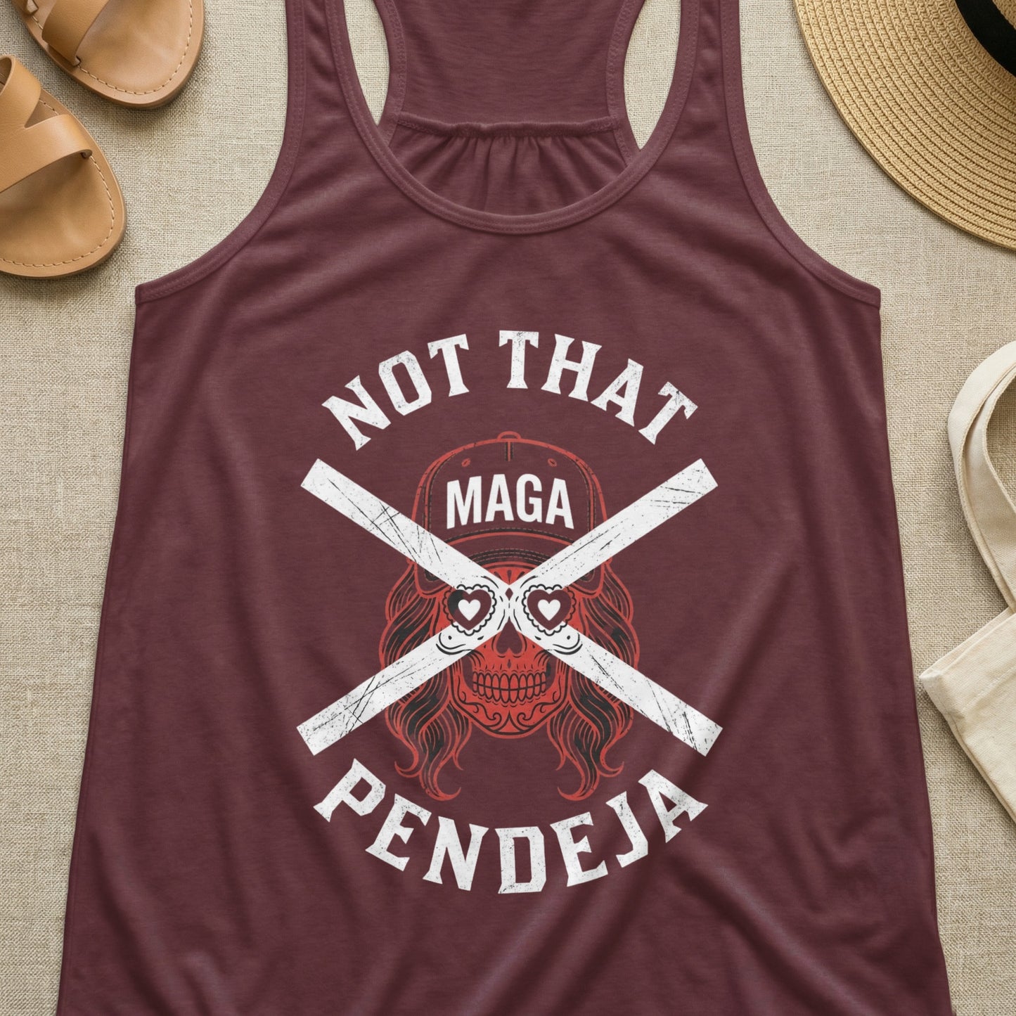 Maroon tank top with "NOT THAT PENDEJA" and skull graphic.