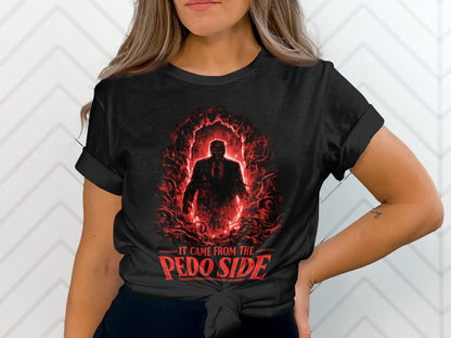 Black t-shirt featuring a silhouette of a figure in a red, smoky, cave-like illustration with text "IT CAME FROM THE PEDO SIDE".