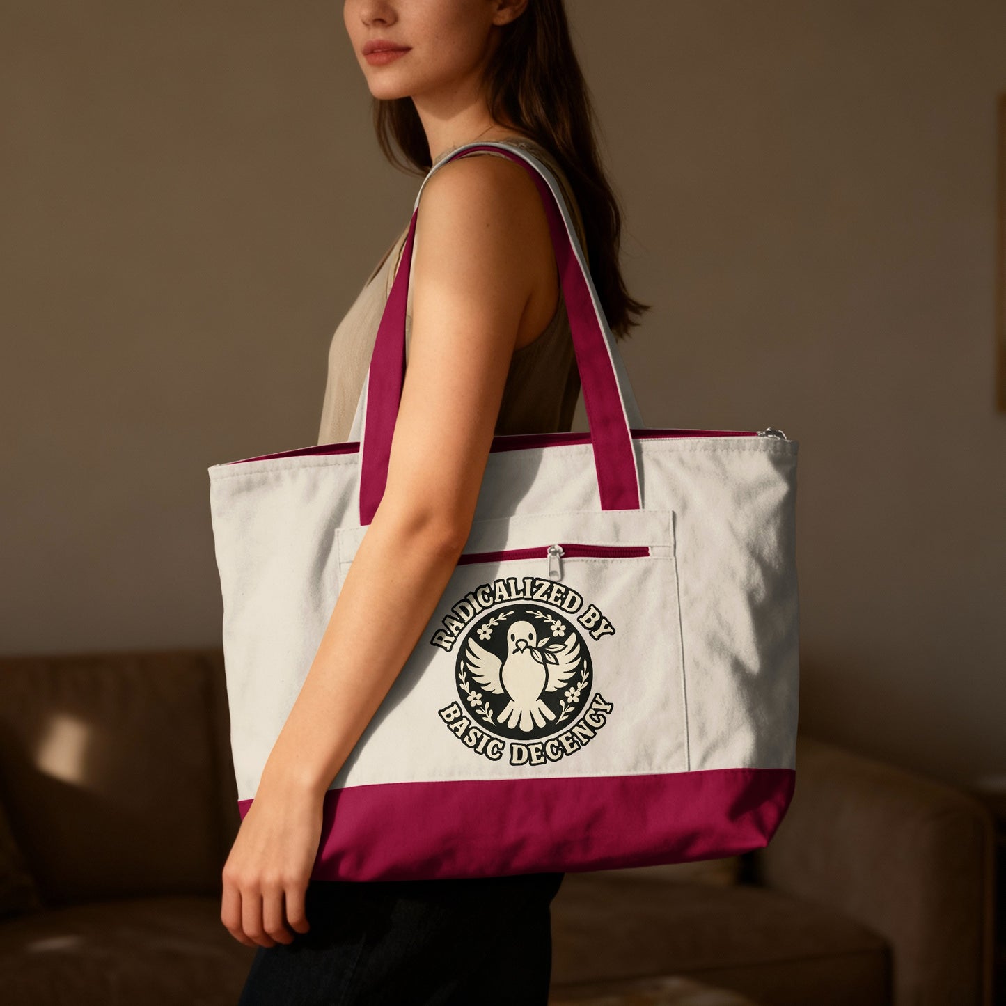 Tote bag with "Radicalized by Basic Decency" text and dove emblem.