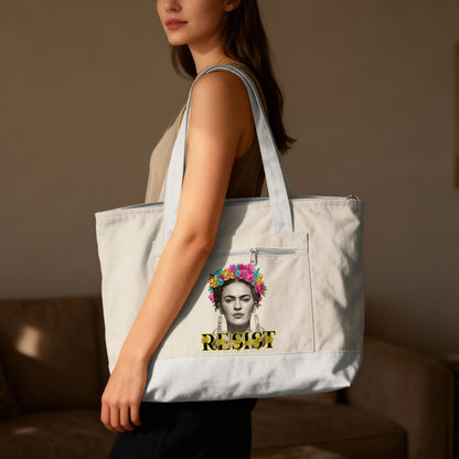 Tote bag featuring Frida Kahlo portrait and "RESIST" text.