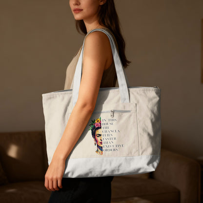 Tote bag with Frida Kahlo artwork and inspirational text.