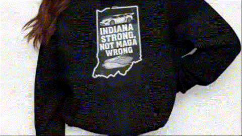 a person wearing a black hoodie with a graphic design on the back.