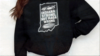 a person wearing a black hoodie with a graphic design on the back.