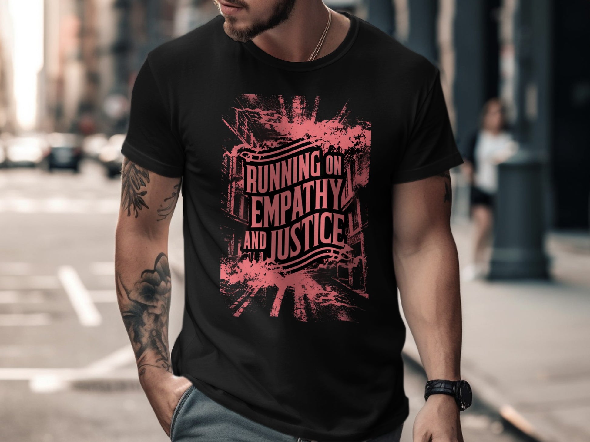 Black t-shirt with "Running on Empathy and Justice" text in pink distressed font.