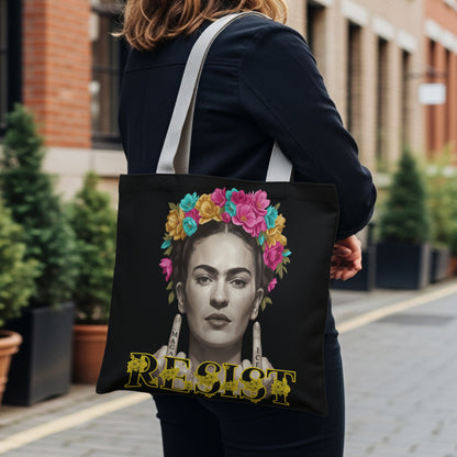Frida Kahlo portrait with "RESIST" text on a black tote bag.