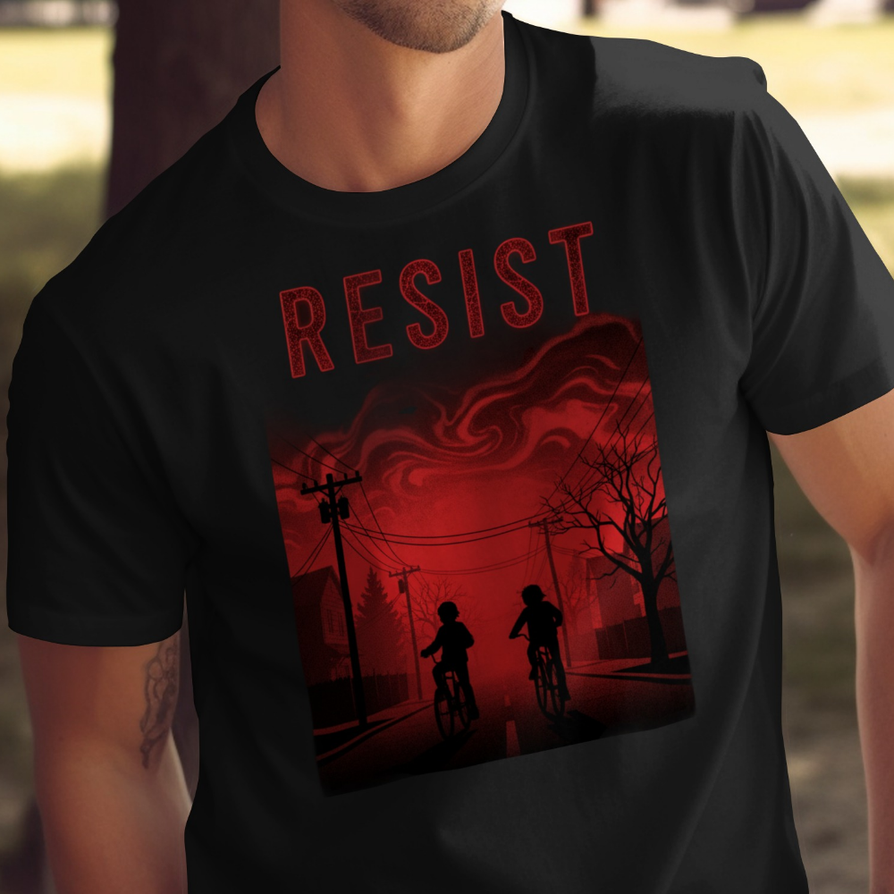 T-shirt graphic: two people on bikes under red stormy sky with "RESIST" text.