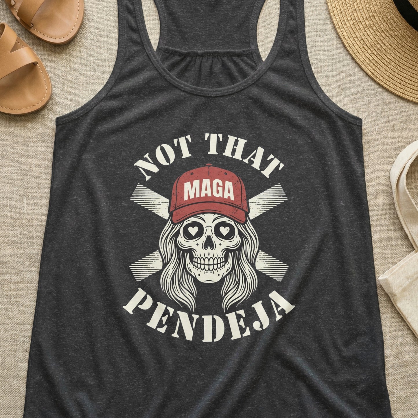 Dark gray tank top with skull wearing MAGA hat and text "NOT THAT PENDEJA".