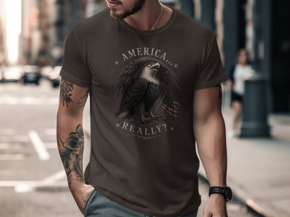 Dark brown t-shirt with eagle and American flag graphic and "America...Really?" text.