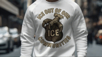A person wearing a white sweatshirt with a graphic design on it.
