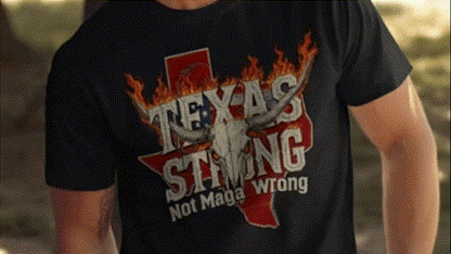 A person wearing a black t-shirt with a graphic design that says "Texas Strong Not Maga Wrong".