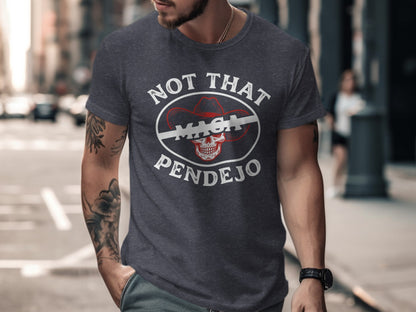 Dark t-shirt with white text "NOT THAT MAGA PENDEJO" and a cowboy hat skull graphic.