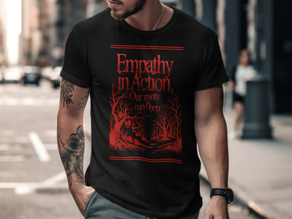 Black t-shirt with red text and stylized trees: "Empathy in Action Our roots run deep"