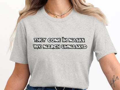 They Come in Masks We March Unmasked T-Shirt product