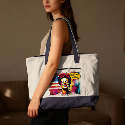 Woman wearing tote bag with colorful Frida Kahlo illustration and text.