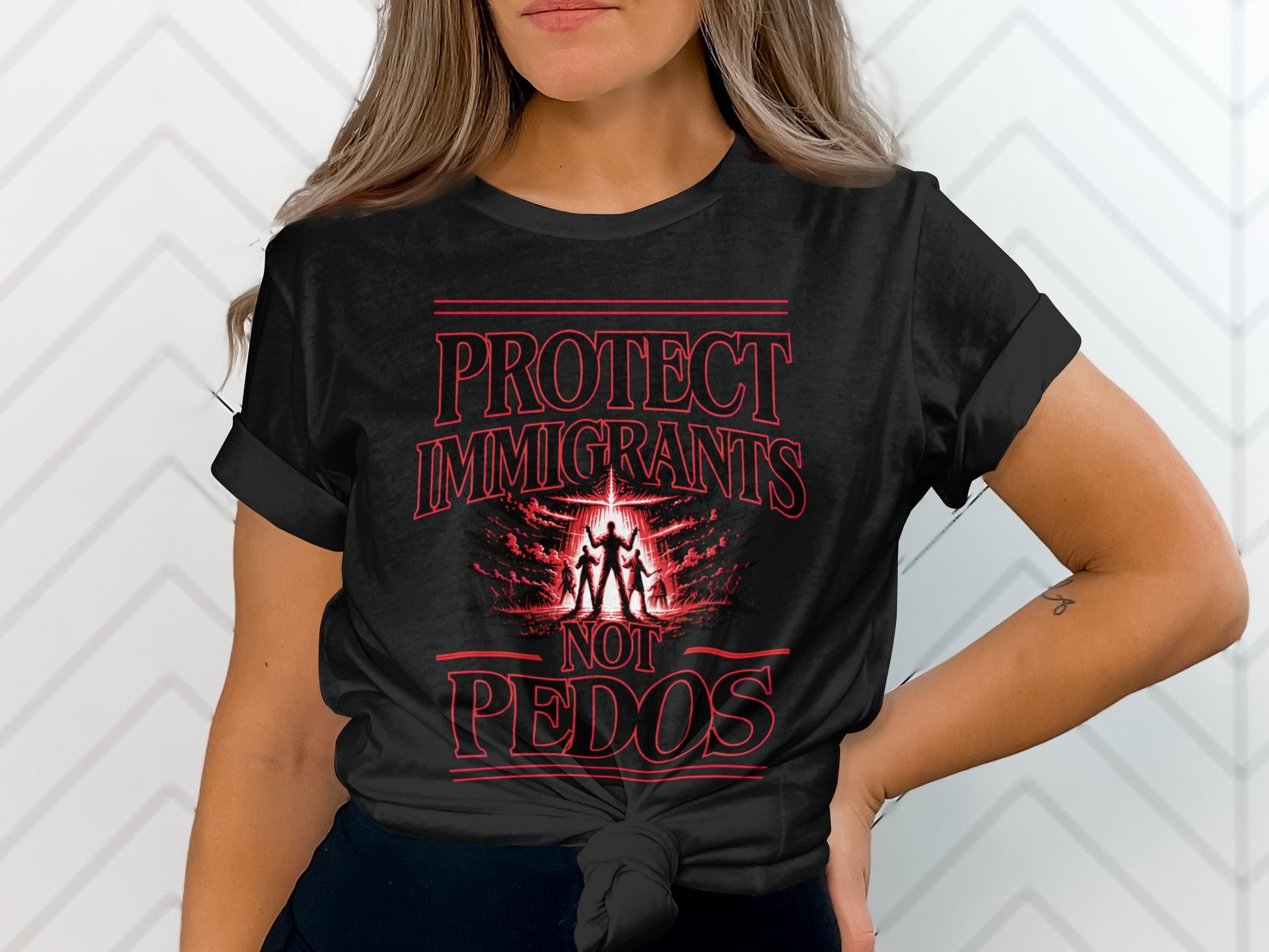 Black t-shirt with red text: PROTECT IMMIGRANTS NOT PEDOS, and a silhouette of three figures.