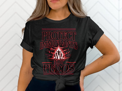 Black t-shirt with red text: PROTECT IMMIGRANTS NOT PEDOS, and a silhouette of three figures.