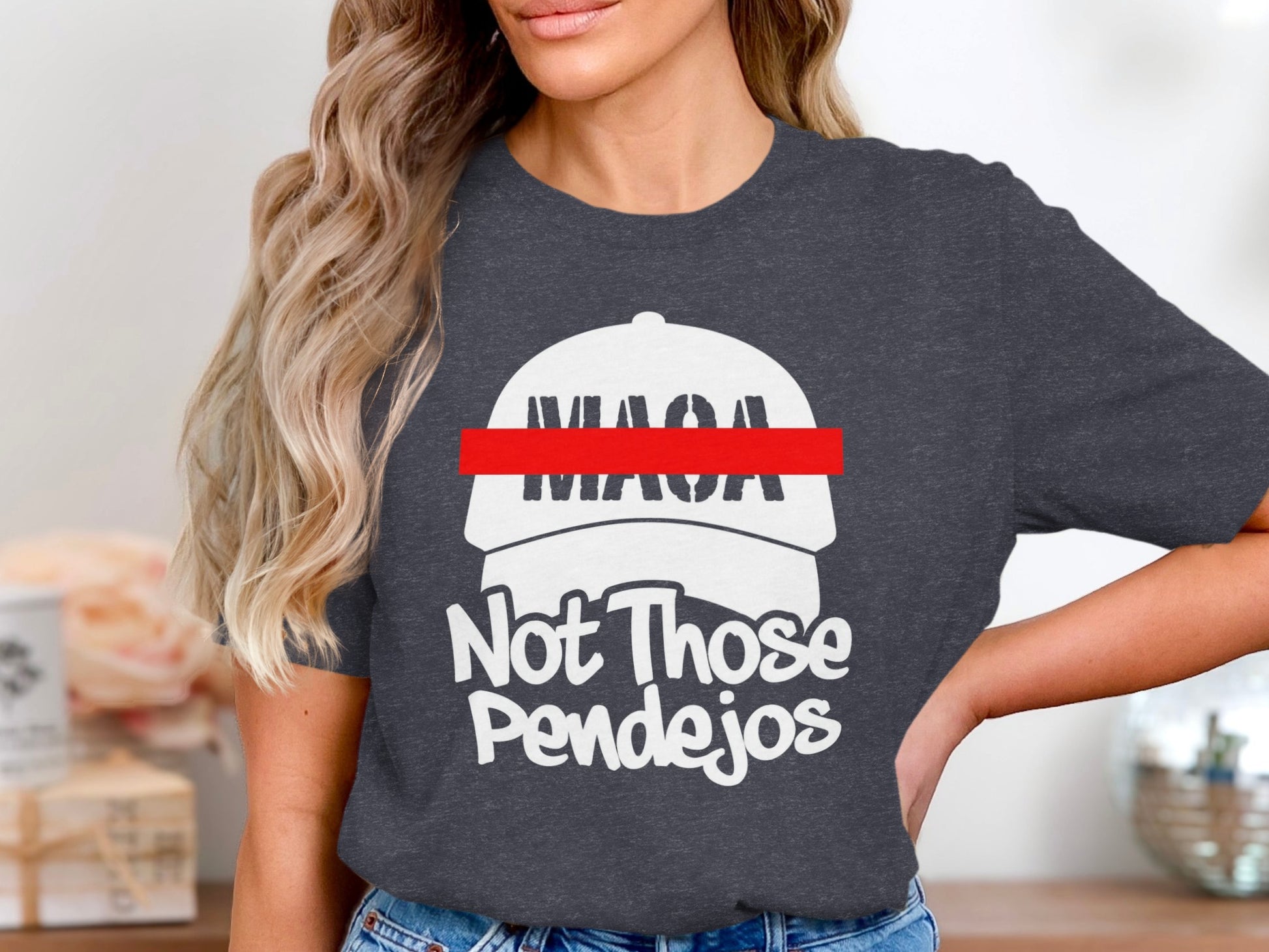 Dark t-shirt with white text: "MAGA" hat silhouette, "Not Those Pendejos".