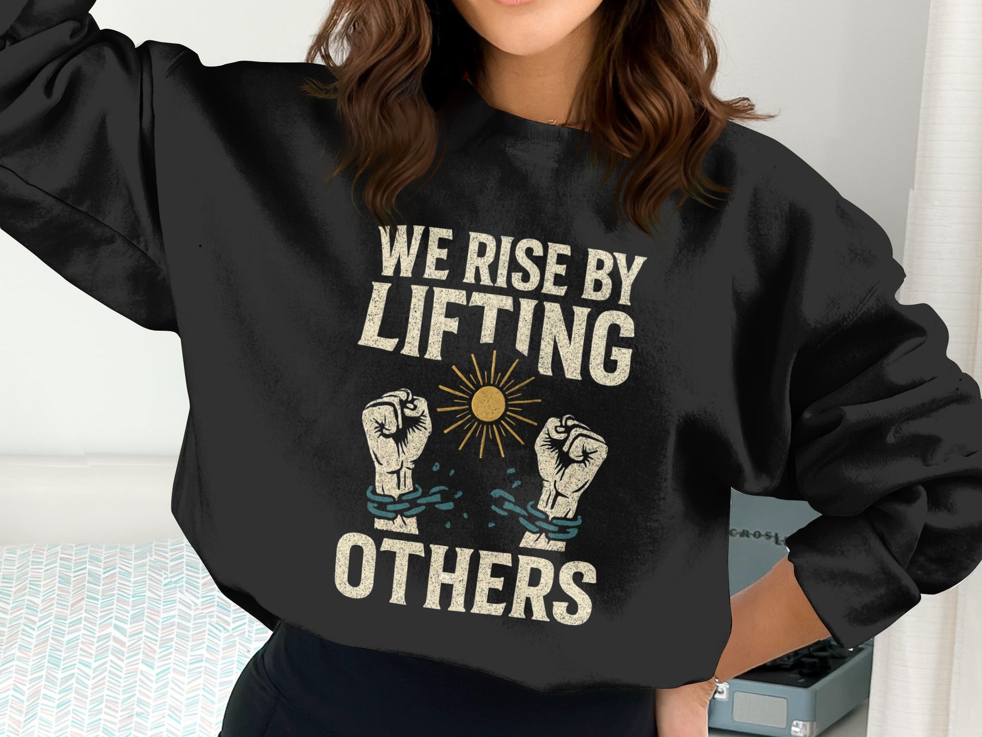 We Rise By Lifting Others Graphic Sweatshirt Product