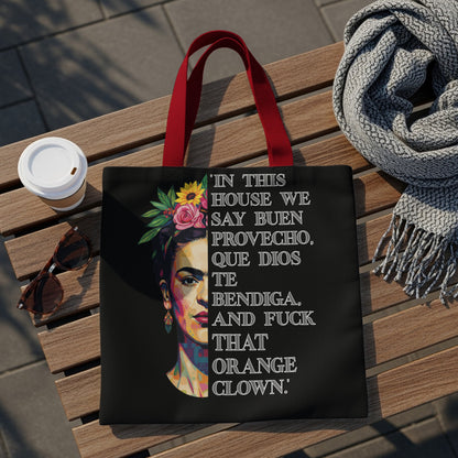 Tote bag with Frida Kahlo graphic and Spanish text about blessings and an orange clown.