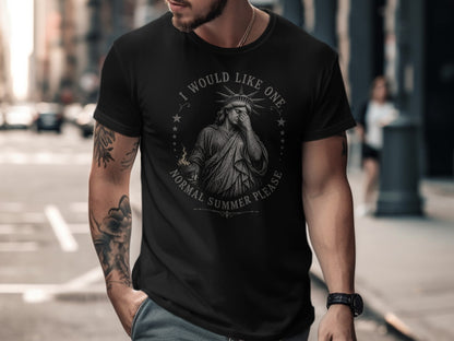 Black t-shirt with Statue of Liberty and text "I would like one normal summer please".