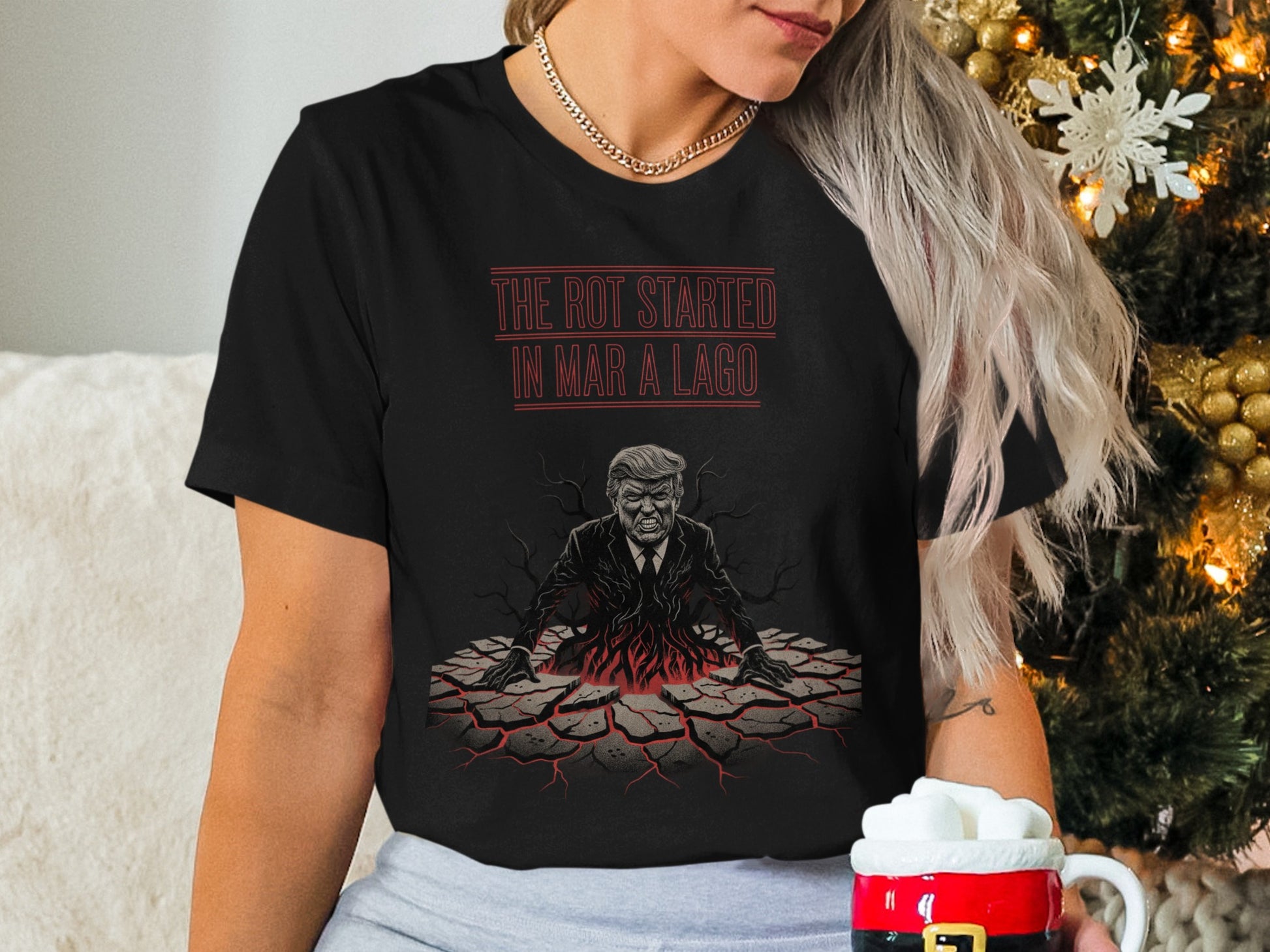 Black t-shirt with red cracked earth graphic and text "THE ROT STARTED IN MAR-A-LAGO".