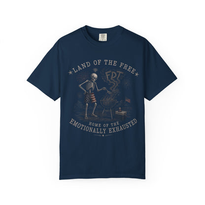 Navy t-shirt with skeleton grilling and "Land of the Free, Home of the Emotionally Exhausted" text.