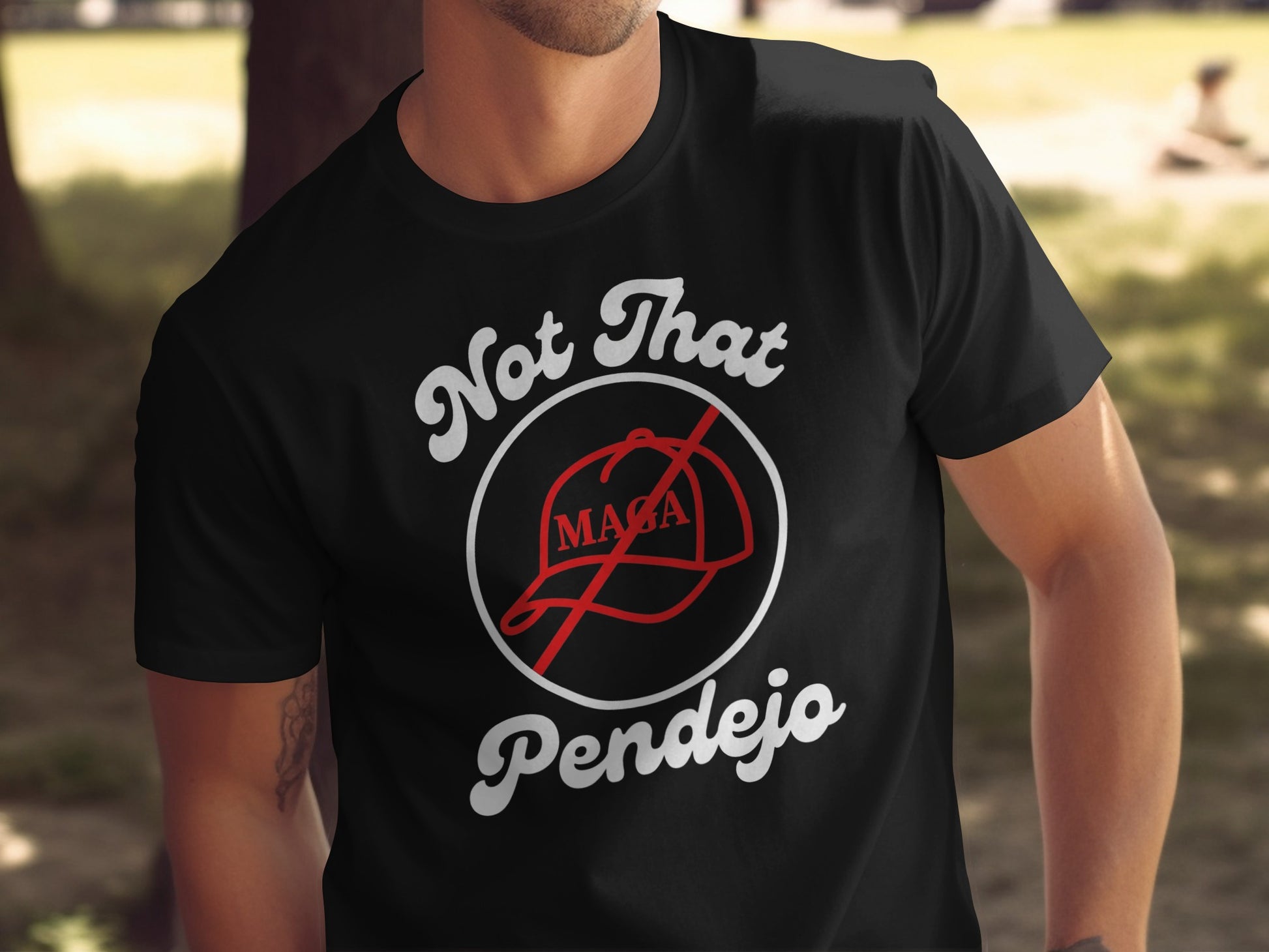 Black t-shirt with "Not That MAGA Pendejo" and a crossed-out MAGA hat.