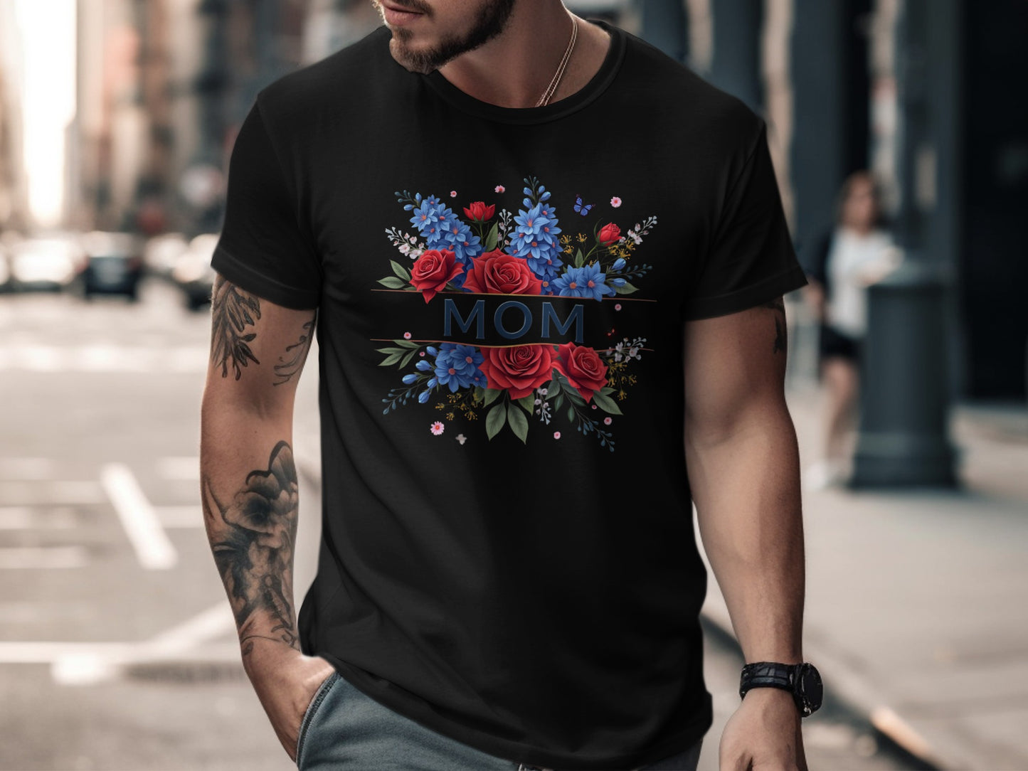 Black t-shirt with "MOM" in stylized letters surrounded by red roses and blue flowers.