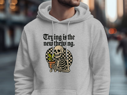 Trying is the New Thriving Skeleton Graphic Hoodie Product