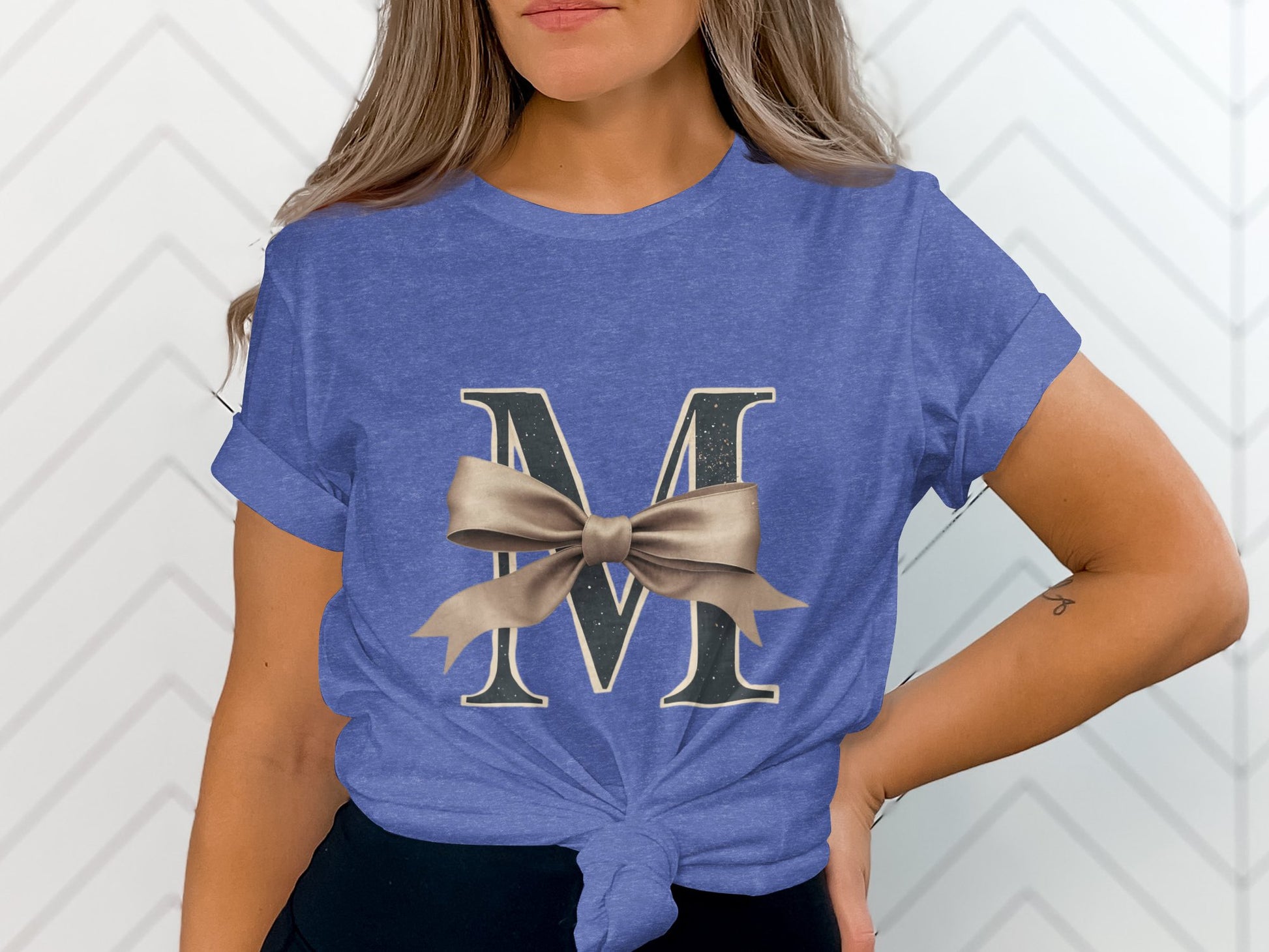 Stylish Blue Tee with Large M and Bow Design product