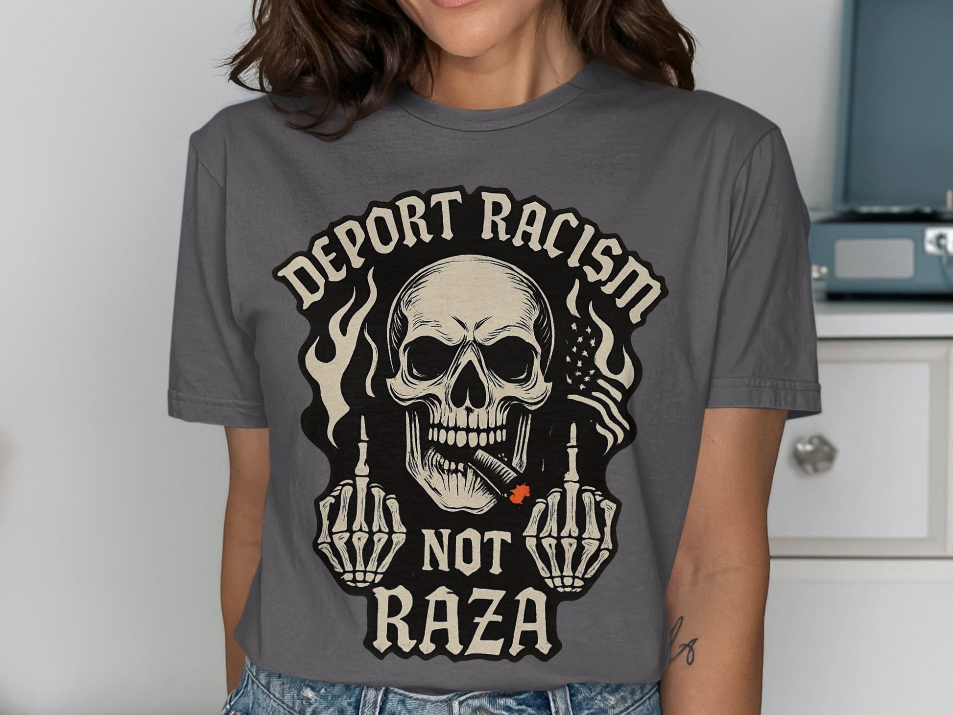 Deport Racism Not Raza Skull Graphic Tee product