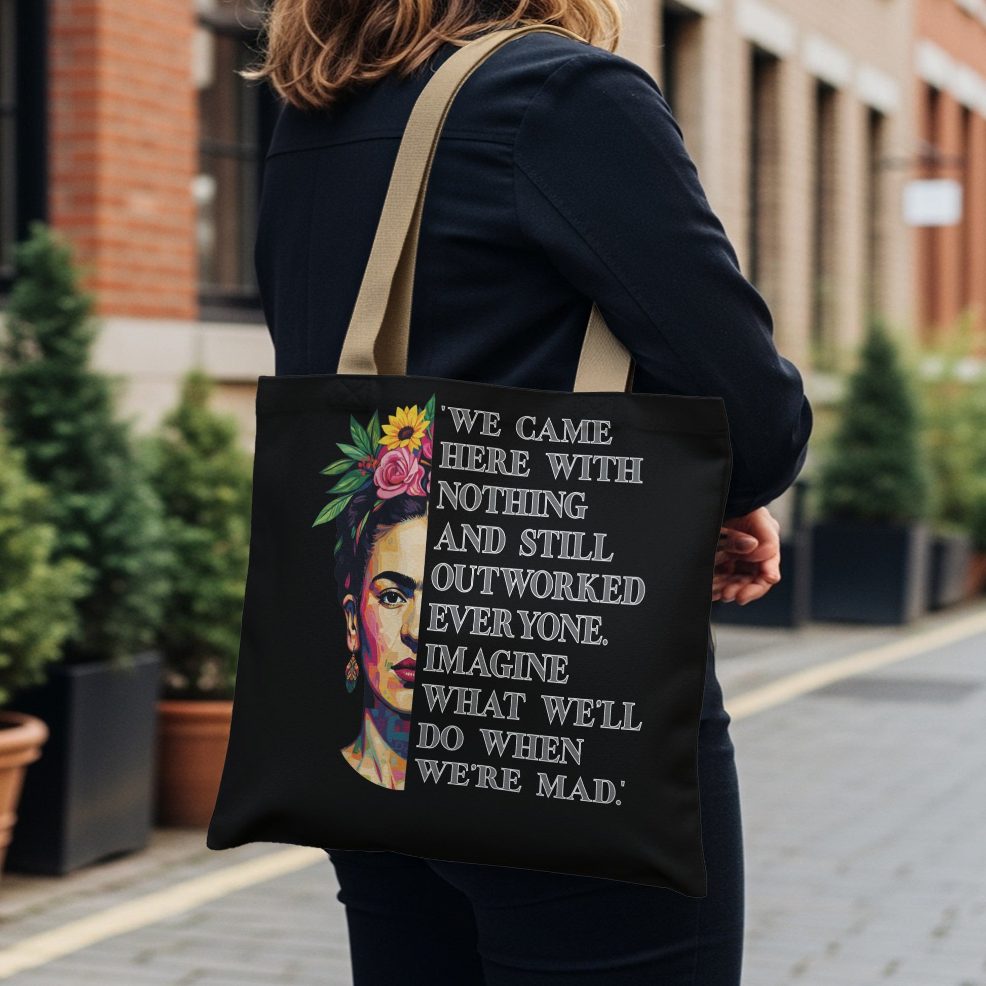 Tote bag with Frida Kahlo graphic and quote about working hard.