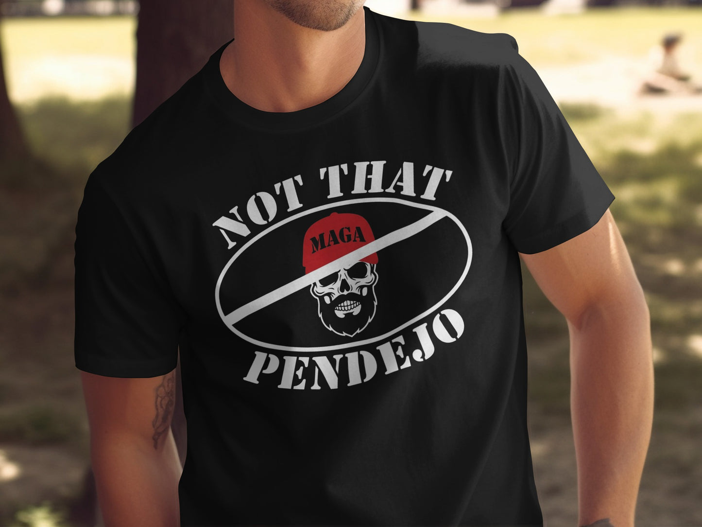 Black t-shirt with "NOT THAT PENDEJO" and a red "MAGA" hat over a skull icon.