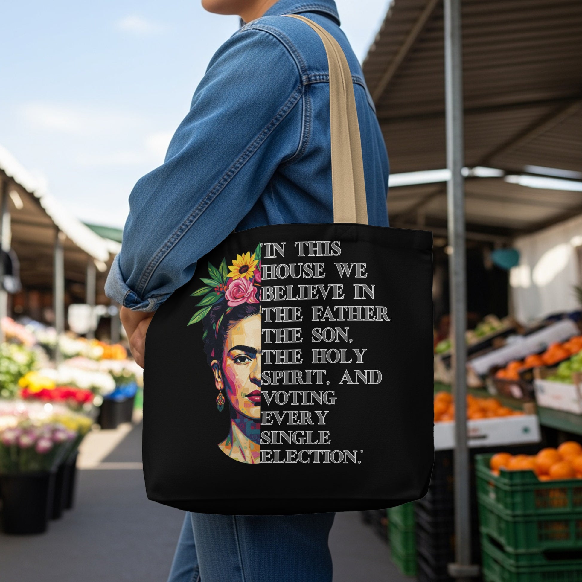 Black tote bag with Frida Kahlo graphic and text about voting.