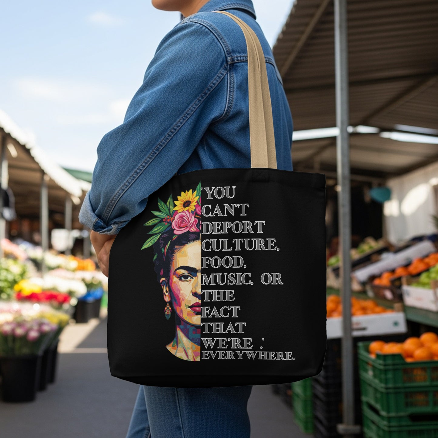 Black tote bag with Frida Kahlo portrait and empowering quote about culture.